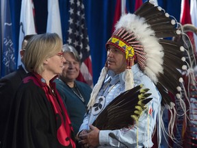 Assembly of First Nations Chief Perry Bellegarde speaks with Indigenous and Northern Affairs Minister Carolyn Bennett
