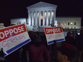 Demonstrators gather outside of The United States Supreme Court after President Donald Trump announced Neil Gorsuch as his nominee