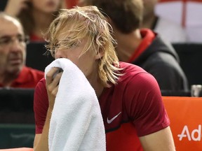 Denis Shapovalov of Canada reacts after accidentaly hitting chair umpire Arnaud Gabas in the head with a ball during Davis Cup action on Feb. 5.