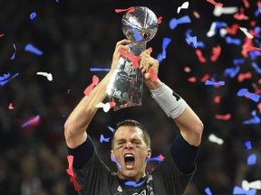 Tom Brady holds the Vince Lombardi Trophy after defeating the Atlanta Falcons 34-28 in overtime during Super Bowl 51 at NRG Stadium on February 5, 2017