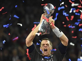 Tom Brady of the New England Patriots holds the Vince Lombardi Trophy after defeating the Atlanta Falcons 34-28 in overtime during Super Bowl 51 at NRG Stadium on February 5, 2017 in Houston, Texas.