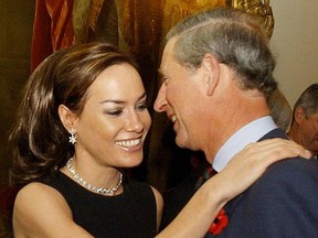 This file photo taken on October 27, 2003 shows Prince Charles, Prince of Wales being greeted by British socialite Tara Palmer Tomkinson during a reception at Clarence House in London. Palmer-Tomkinson died on February 8, 2017, at the age of 45, a year after being diagnosed with a non-malignant brain tumour.