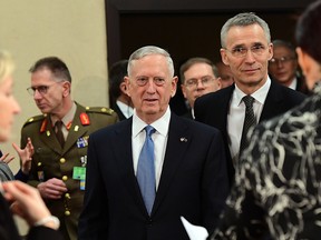 US Defense Minister James Mattis (C) and NATO Secretary General Jens Stoltenberg arrive to attend a NATO defence ministers meetings at NATO headquarters in Brussels on February 15, 2017.