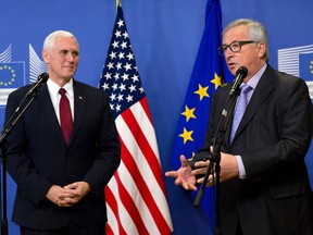 US Vice-President Mike Pence and European Commission President Jean-Claude Juncker give a press conference at the European Commission in Brussels on February 20. Pence sought to reassure Europe of Donald Trump's commitment to transatlantic ties as he met EU chiefs in the face of anti-Trump protests.