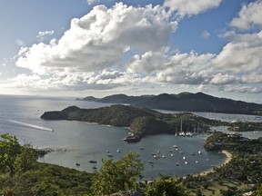 The view of English Harbour, Nelson's Dockyard and Falmouth Harbour greets visitors to  Shirley Height's Lookout in Antigua, who come for the sunset barbecue and steel band on Sunday nights.