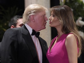 President Donald Trump talks with first lady Melania Trump as they arrive for the 60th annual Red Cross Gala at Trump's Mar-a-Lago resort in Palm Beach, Fla., Saturday, Feb. 4, 2017