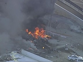 The site of a plane crash at Essendon Airport in Melbourne, Australia Tuesday, Feb. 21, 2017. An official says a light plane has crashed into a shopping mall beside the airport.