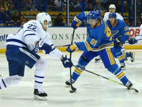 Vladimir Tarasenko, right, of the St. Louis Blues, lets go with a shot against the Toronto Maple Leafs during NHL action Thursday night in St. Louis. The Blues made a winner out of new coach Mike Yeo with a 5-1 victory over the Leafs, losers of their last three games.
