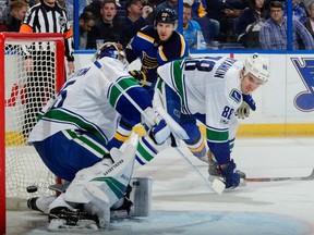 Alexander Steen of the St. Louis Blues finds the net behind Vancouver Canucks' goaltender Jacob Markstrom during NHL action Thursday night in St. Louis. Canucks defender is Nikita Tryamkin. The Blues were 4-3 winners.