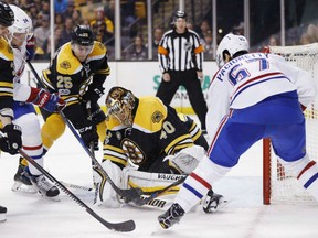 Goaltender Tuukka Rask of the Boston Bruins goes low to the ice to stop the scoring attempt of Montreal Canadiens' Max Pacioretty during NHL action Sunday in Boston. Rask had 25 saves in Boston's 4-0 victory, giving them three straight wins under new coach Bruce Cassidy.
