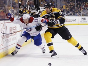 Boston Bruins defenceman Zdeno Chara (right) checks Montreal Canadiens forward Brendan Gallagher on Feb. 12.
