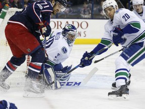 Vancouver Canucks' Ryan Miller was at his best against Nick Foligno and the Columbus Blue Jackets in NHL action Thursday night, making 33 saves in the Canucks' 3-0 victory.