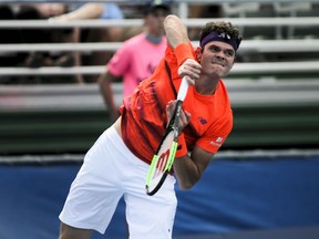 Milos Raonic serves to Tim Smyczek during the Delray Beach Open on Feb. 21.