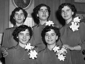 The Dionne quintuplets are shown in a 1952 photo. Front row (left to right) Cecile and Yvonne, and back row (left to right) Marie, Emilie and Annette.