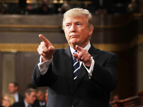 U.S. President Donald Trump points to the audience after addressing a joint session of Congress on Feb. 28, 2017.