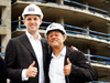 Eric Trump, left, stands with YY Development Group owner Moises Yellati outside Trump Tower under construction in Punta del Este, Uruguay on Jan. 3, 2017.