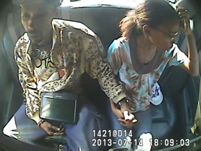 Joel France and Marleny Cruz being taken to a police station on July 14, 2013.