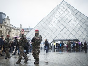 French soldiers patrol in the courtyard of the Louvre museum in Paris, Saturday, Feb. 4, 2017.  The Louvre in Paris reopened to the public Saturday morning, less than 24-hours after a machete-wielding assailant shouting "Allahu Akbar!" was shot by soldiers, in what officials described as a suspected terror attack.