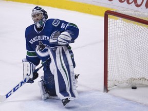 Vancouver Canucks goalie Ryan Miller reacts to being scored on by San Jose Sharks centre Logan Couture on Feb. 25.