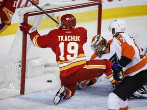 Philadelphia Flyers goalie Michal Neuvirth looks behind him as the Flame' Matthew Tkachuk scores a goal during the first period in Calgary on Wednesday night.