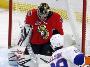 Senators goalie Craig Anderson makes a save on a shot by the New York Islanders' Brock Nelson during third period NHL action in Ottawa on Saturday night.