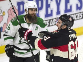 Patrick Eaves of the Dallas Stars looks on as the Senators' Mark Stone celebrates his goal during the third period of their game in Ottawa on Thursday night. The Senators beat the Stars 3-2.