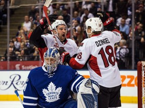 Mark Stone celebrates with Ottawa Senators teammate Ryan Dzingel after a goal by Chris Wideman as Maple Leafs goalie Frederik Andersen looks on during first period action in Toronto on Saturday night.