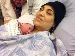 Ibtesam Alkarnake poses with baby Eyad after giving birth at the Northern Lights Regional Health Centre on Wednesday, February 1, 2017. The Alkarnake family had arrived in Canada the night before from a refugee camp in Jordan.