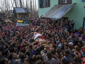 Kashmiri villagers carry body of Mudasir Ahmed, one among four suspected rebels killed at his residence in Redwani, 65 kilometres south of Srinagar, Indian controlled Kashmir, Sunday, Feb. 12, 2017. Four suspected rebels, two Indian army soldiers and a civilian have been killed in a fierce gunbattle in Indian-controlled Kashmir, officials said Sunday.