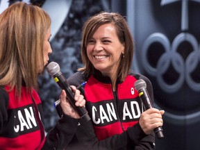 Former short-track speedskater Isabelle Charest smiles Monday in Montreal as Nathalie Lambert introduces her as Canada's chef de mission for the 2018 Winter Olympic Games in Pyeongchang, South Korea.