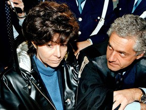 Patrizia Reggiani(L), 50, ex-wife of slain Italian fashion mogul Maurizio Gucci, exits court 03 November 1998 in Milan after she was sentenced to 29 years in jail for plotting his murder. The person at right is unidentified.