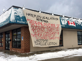 A banner attached to the wall of MP Kellie Leitch's office Wednesday lists the names of the six victims of Sunday's Quebec City mosque shooting.