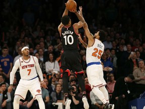 Toronto Raptors' DeMar DeRozan lets go with a jumper with 1.9 seconds left on the clock and being defended by Derrick Rose of the New York Knicks in NBA action Monday night in New York. DeRozan's shot found nothing but net, providing the margin of victory in a 92-91 victory at Madison Square Garden. The victory was the Raptors' fourth straight.