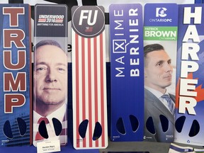 MPrinthouse shows off their Handee Signs, including signs for U.S. President Donald Trump and fictional character Frank Underwood from the Netflix series "House of Cards," at their exhibitor's table at the Manning Centre conference on Friday, Feb. 24, 2017 in Ottawa.
