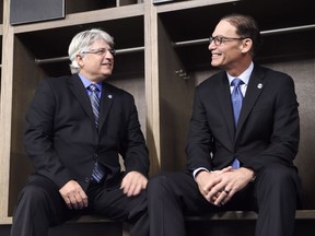 New Toronto Argonauts head coach Marc Trestman, right, and new general manager Jim Popp pose for a photo ahead of a press conference to announce their hirings in Toronto on Feb. 28, 2017.
