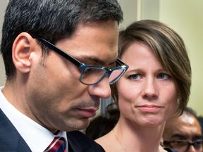 Quebec MNA Gerry Sklavounos, booted out of the Liberal caucus for alleged sexual improprieties, speaks to media alongside his wife Janneke on Thursday in Montreal.