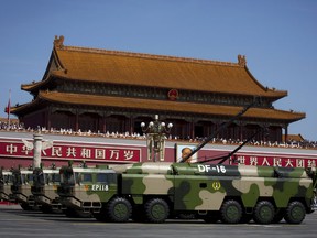Military vehicles carry DF-16 short-range ballistic missiles past Tiananmen Gate during a military parade Sept. 3, 2015. The highly accurate Chinese ballistic missile capable of threatening U.S. and Japanese bases in Asia has made its latest appearance at recent Rocket Force drills.