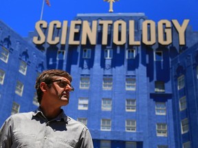 Theroux standing by Hollywood's Scientology headquarters.