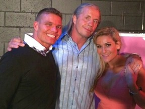 Natalya Neidhart, right, with her uncle, Bret Hart (centre), and her husband, T.J. Wilson.