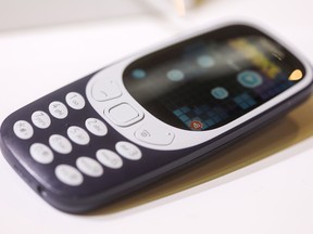 A Nokia 3310 mobile phone, manufactured by HMD Global Oy its on display on the opening day of the Mobile World Congress (MWC) in Barcelona, Spain, on Monday.