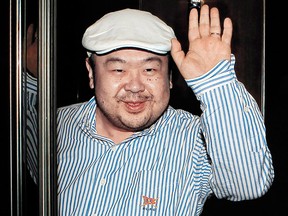Kim Jong-nam  waves after his first-ever interview with South Korean media in Macau, on June 4, 2010