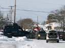 A road block scene in Pincher Creek, Alta, about 200 km south of Calgary, Alta, showing an RCMP unit on scene of an armed standoff on Wednesday Feb. 8, 2017. 