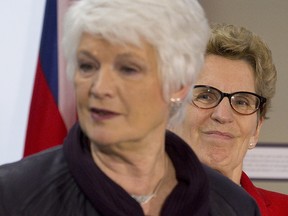 Ontario premier Kathleen Wynne watches Liz Sandals