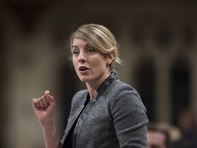 Minister of Canadian Heritage Melanie Joly rises during Question Period in the House of Commons on Parliament Hill, Thursday, Feb. 16, 2017 in Ottawa.