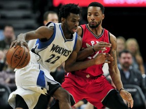 Timberwolves forward Andrew Wiggins drives with the ball against Toronto Raptors guard Norman Powell during the fourth quarter of their game on Wednesday night in Minneapolis. The Timberwolves won 112-109.