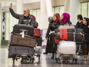 Mazen Khabbaz  and his family are one of two Syrian refugee families that  arrived in Toronto Pearson International Airport in Mississauga, Ont.  on Wednesday December 9, 2015.