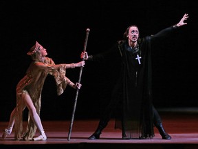 In this 2012 file photo, Russian dancer Pavel Dmitrichenko, as Ivan the Terrible, right, and ballerina Anna Nikulina as Anastasia, perform at a dress rehearsal