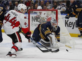Sabres goalie Robin Lehner makes a stick save against Ottawa Senators forward Jean-Gabriel Pageau during the second period of their game, Saturday night in Buffalo, N.Y.