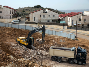 Heavy machinery at a construction site in the West Bank Jewish settlement of Ariel