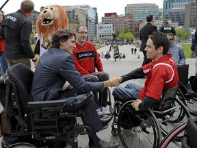 Justin Trudeau shaking hands with Canadian Wheechair Rugby National Team Member Patrice Dagenais